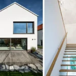 Modernes weißes Haus von außen mit großen Fenstern und Glastüren und einer Holztreppe mit Glasgeländer im Inneren.